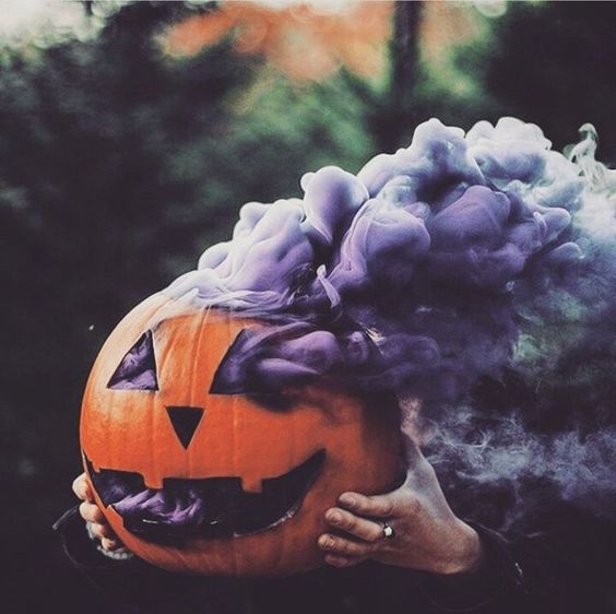 Image of pumpkin with purple smoke